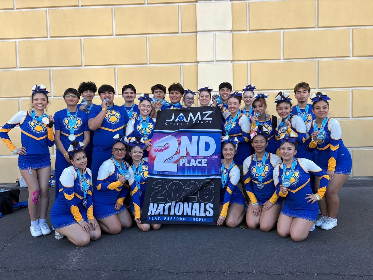 Caldwell High School Cheer Show Team celebrates their 2nd place finish at the JAMZ Cheer & Dance Nationals, holding up their banner outside. Photo credit: Courtesy of Caldwell Cheer Facebook page
